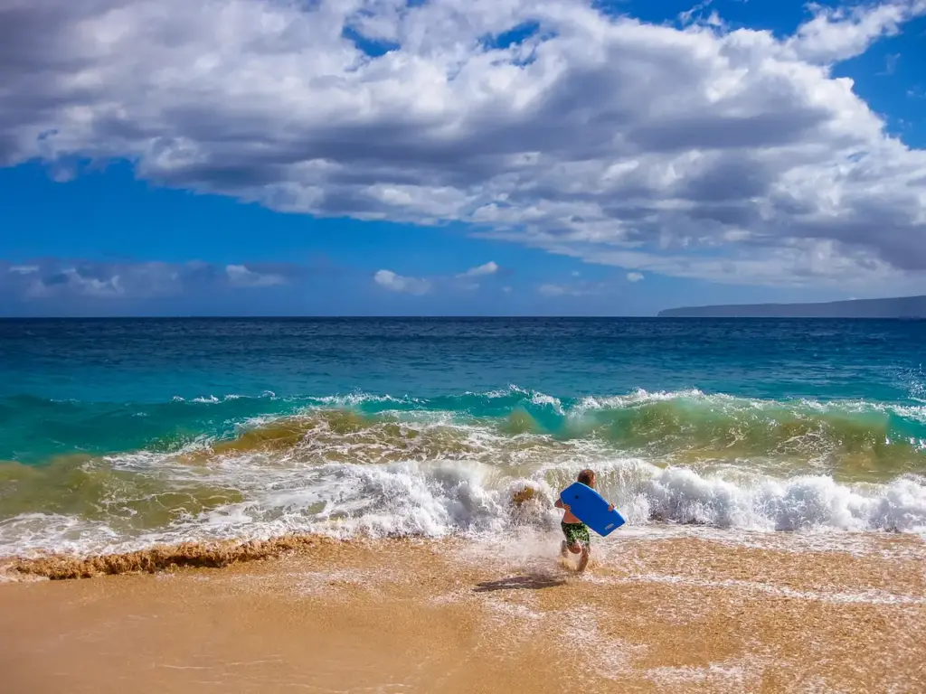 Man Holding Surf Board 